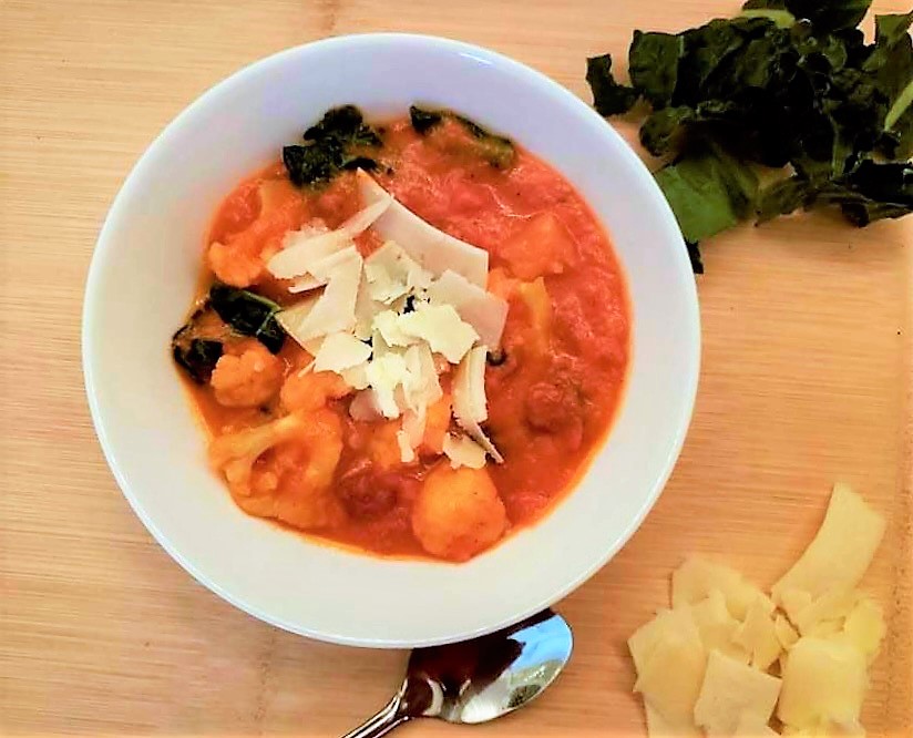 Easy Tomato Vegetable Soup Topped with Parmesan Cheese