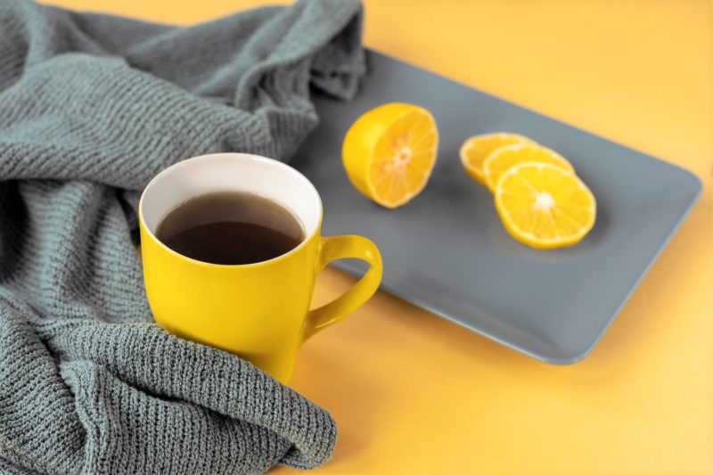 Closeup photo of black coffee and lemon juice