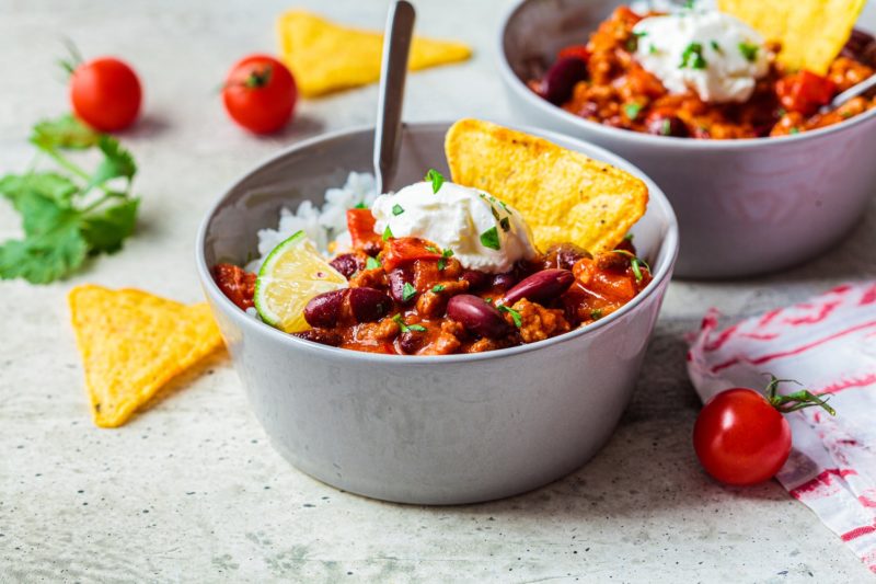A hearty bowl of chili with tortilla chips