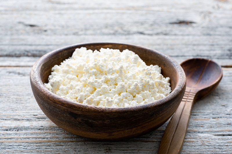 Bowl of cottage cheese with a spoon