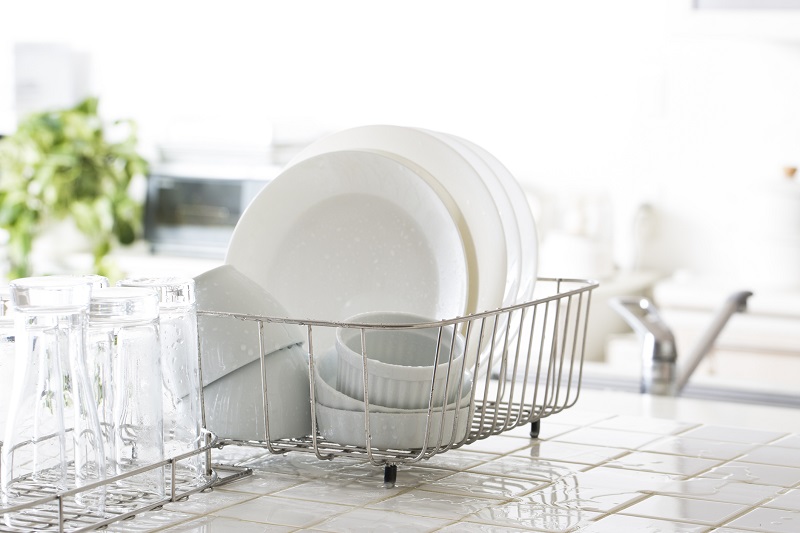 White dishware on a drying rack