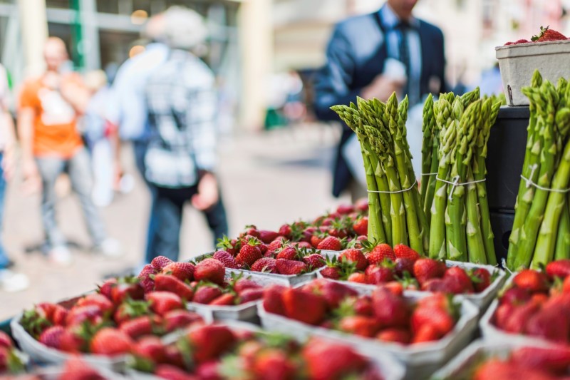 strawberries and asparagus at the farmers market