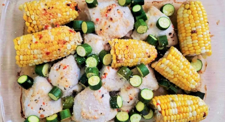 Baked Chicken, Corn and Zucchini in a glass baking dish