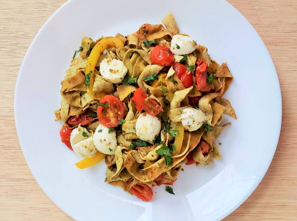 Low Carb pasta made from Egg White Wraps With tomatoes, mozzarella and peppers.