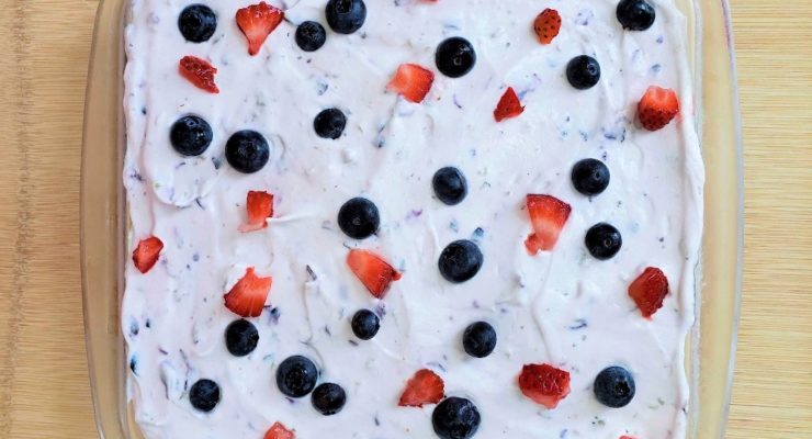 red, white and blue berry dessert lasagna with blueberries and strawberries