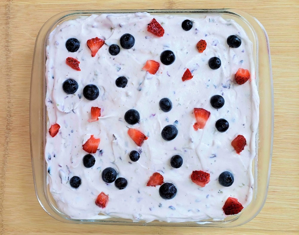 red, white and blue berry dessert lasagna with blueberries and strawberries