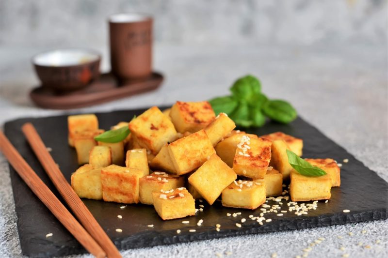 Air Fryer vegetarian tofu meal with chopsticks next to it