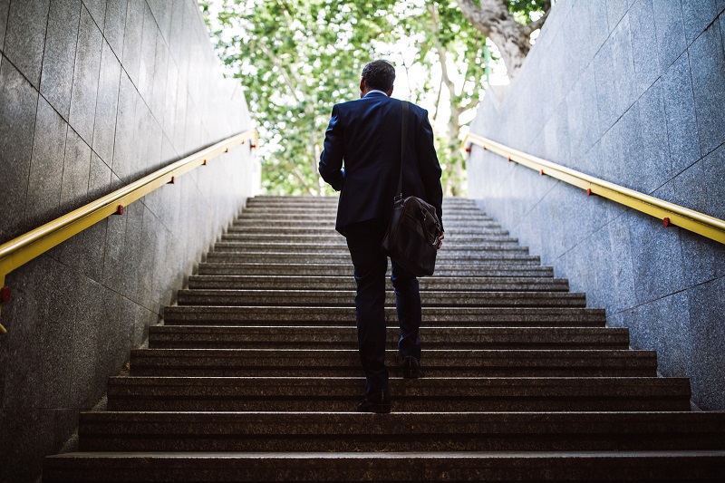 Businessman Walking up stairs