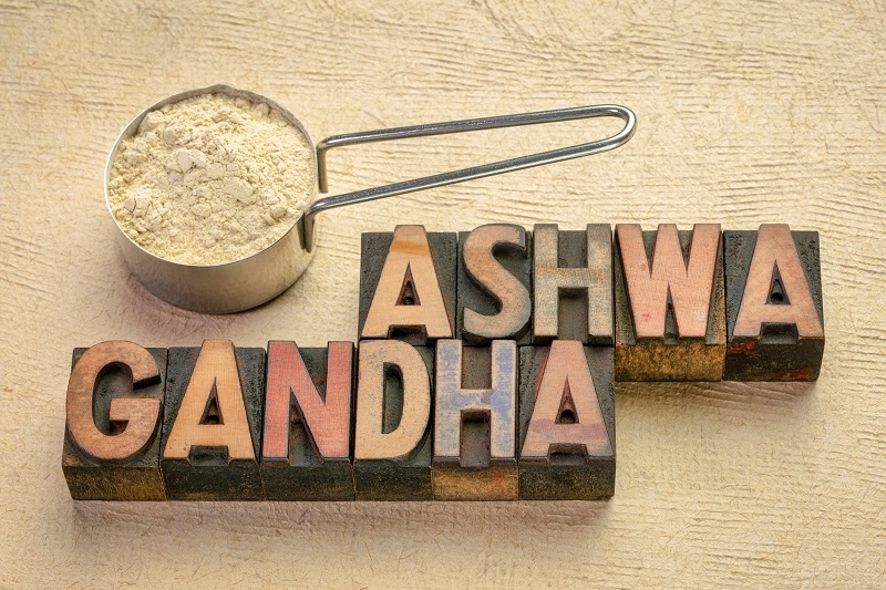 Powered form of the herb next to blocks spelling out Ashwagandha 