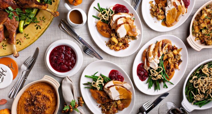 healthy thanksgiving recipes on a table with assembled dinner plates