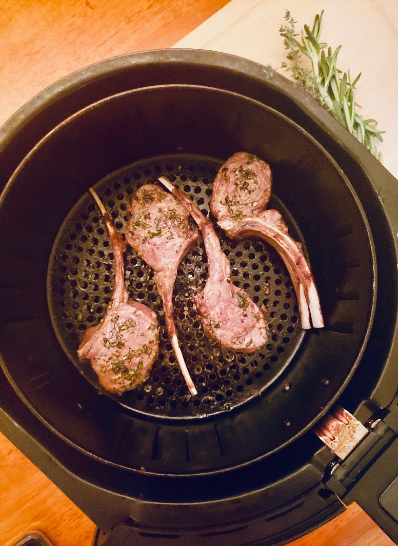 rack of lamb prepared in the air fryer with fresh herbs