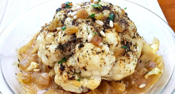 instant pot roasted head of cauliflower with herbs, veggies and pine nuts