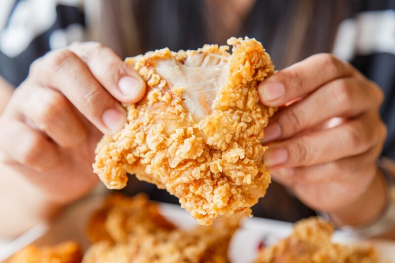 eating fried chicken