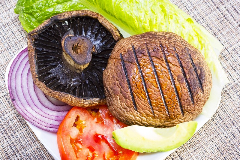 grilled portobello mushrooms with vegetables on a plate