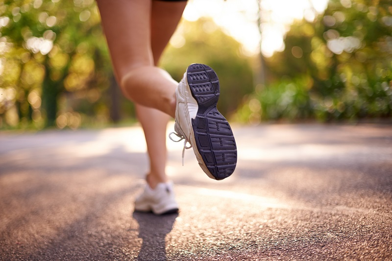 Cropped shot of a female athlete running outdoors