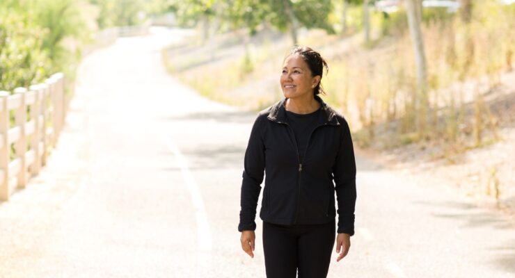 happy and healthy woman walking to maintain weight loss
