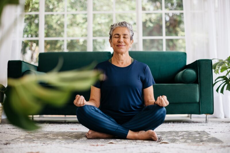 woman meditating at home as a weight loss reward