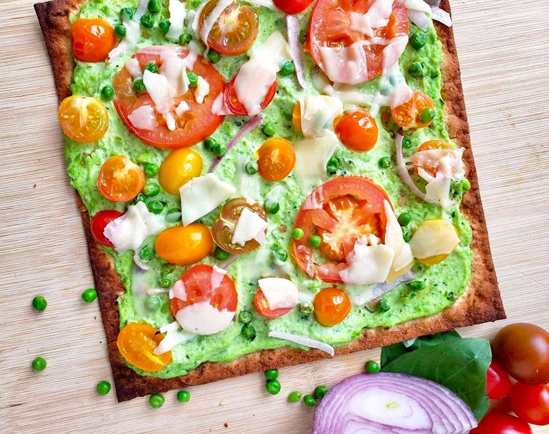 green pea ricotta pizza for spring with fresh vegetables
