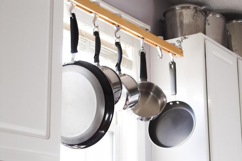hanging pots and pans above sink
