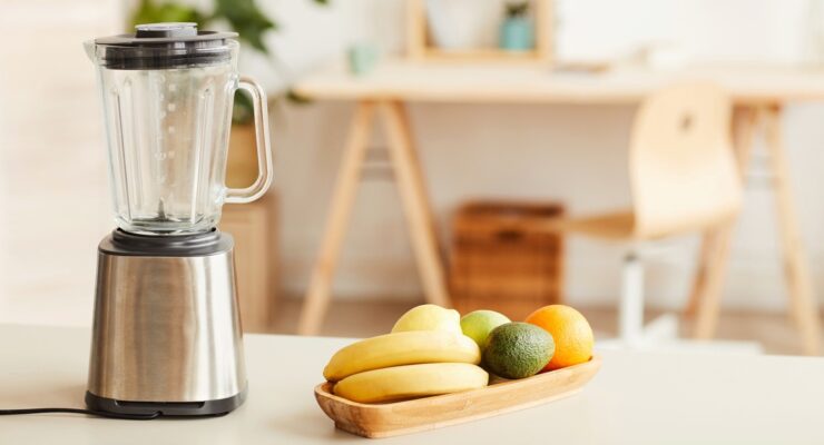 blender and fruit on kitchen counter