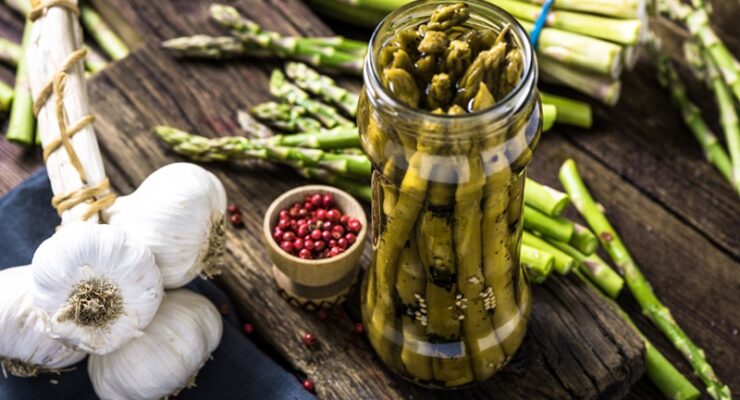 pickled asparagus with garlic and peppercorns in a jar