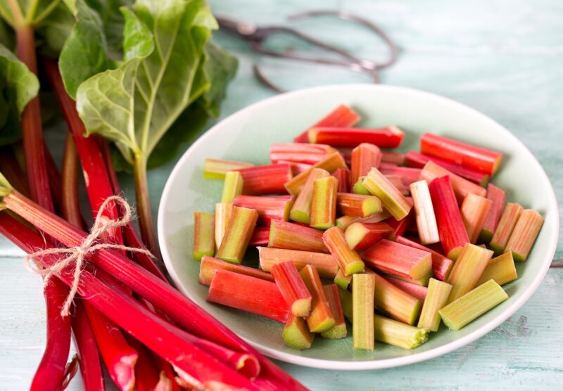 pieces of rhubarb on turquoise wooden surface