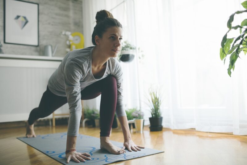 woman exercising at home