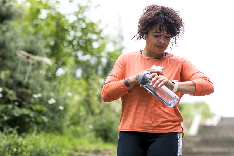 woman exercising looking at watch