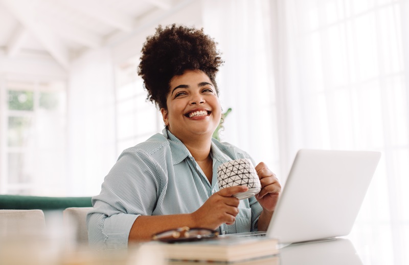 happy woman taking a break while working from home