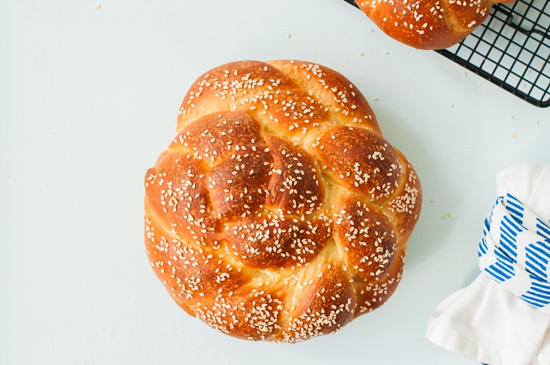 whole wheat round challah bread with sesame seeds