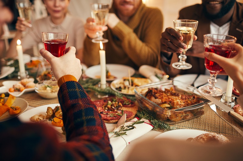 Raising Glasses at Holiday Dinner Party practicing gratitude