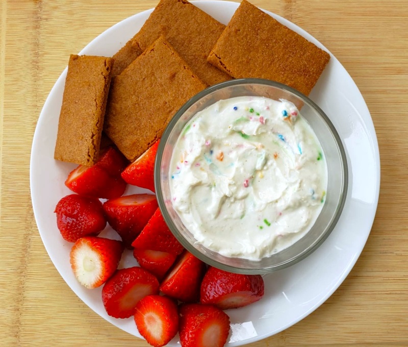 High Protein Cake Batter Dip with fresh strawberries and graham crackers