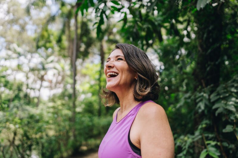happy woman smiling outside
