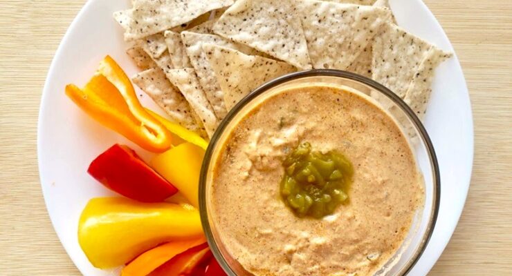 Cottage Cheese Queso Dip with tortilla chips and bell peppers