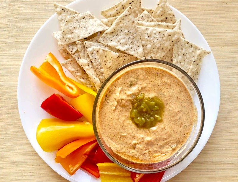 Cottage Cheese Queso Dip with tortilla chips and bell peppers